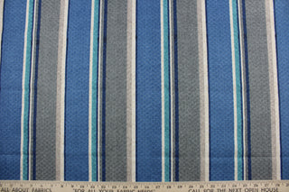  Richloom Solarium© Savaro is a heavy-duty multipurpose outdoor fabric featuring a bold stripe pattern of gray, blue, turquoise, and beige.  It is extremely durable with a 10,000 double rub rating and has been tested to resist 500 hours of exposure to sunlight.  The fabric is also water and stain resistant.  Perfect for porches, patios and pool side.  Uses include toss pillows, cushions, upholstery, tote bags and more. 