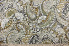Load image into Gallery viewer,  The Robert Allen© Zen Paisley in Amber is a multi-use fabric.  It features a classic floral paisley print and an array of versatile colors, such as amber, green, white, and gray.  The fabric is made to last, boasting a 100,000 double rub rating.  It can be used for several different statement projects including window accents (drapery, curtains and swags), toss pillows, headboards, bed skirts, duvet covers, upholstery, and more.
