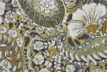 Load image into Gallery viewer,  The Robert Allen© Zen Paisley in Amber is a multi-use fabric.  It features a classic floral paisley print and an array of versatile colors, such as amber, green, white, and gray.  The fabric is made to last, boasting a 100,000 double rub rating.  It can be used for several different statement projects including window accents (drapery, curtains and swags), toss pillows, headboards, bed skirts, duvet covers, upholstery, and more.
