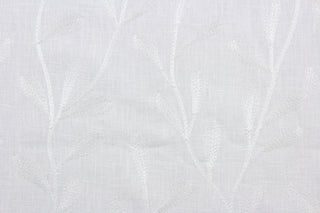 The Embroidered Tangle in Ivory features a stunning vine leaf design that adds an elegant touch to any space. Its multi-purpose use makes it a versatile choice for drapery, pillows, light upholstery, table runners, bedding, headboards, home décor, and even apparel. 