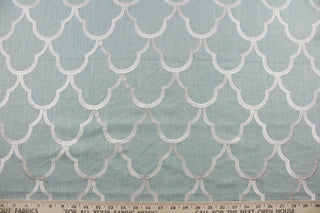 Experience luxurious versatility with our Embroidered Cloud Nine in Spa. This multi-purpose piece features a stunning geometric design with delicate champagne embroidery on a spa green linen based background.  Add a touch of sophistication to drapery, pillows, light upholstery, table runners, bedding, headboards, home décor, and even apparel. Perfect for any style or purpose.