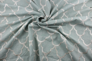 Experience luxurious versatility with our Embroidered Cloud Nine in Spa. This multi-purpose piece features a stunning geometric design with delicate champagne embroidery on a spa green linen based background.  Add a touch of sophistication to drapery, pillows, light upholstery, table runners, bedding, headboards, home décor, and even apparel. Perfect for any style or purpose.