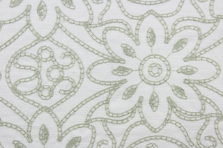 Expertly crafted, the Embroidered Grandfleur in White Shadow is an intricate floral embroidery in sage green against a white background, making a statement of elegance and sophistication.  Uses include drapery, pillows, light upholstery, table runners, bedding, headboards, home décor and apparel.  