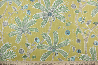 Robert Allen© Indienne Ink in Amber is a multi-purpose fabric featuring palm trees and plants. With a citrine background and green, turquoise amber, gray and white accents, it's sure to draw the eye.  It's also incredibly durable, boasting 65,000 double rubs and a soil and stain repellant finish.  It can be used for several different statement projects including window accents (drapery, curtains and swags), toss pillows, headboards, bed skirts, duvet covers, upholstery, and more.