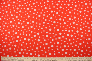 This Blood Orange Glitter Dots fabric features a vibrant polka dot pattern in white set against a blood orange background, with a hint of red glitter for added sparkle.  Enjoy 8 way stretch and comfortable wear while adding a pop of color to your creations.  Perfect for adding sparkle to special occasion apparel, dancewear, costumes, overlays, table tops, and decorations. 