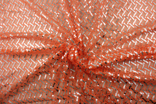 Enhance your style with Sequined Sparkle in Orange.  Silver sequins add a touch of glamour, while the orange tulle base brings a pop of color.  Perfect for adding sparkle to special occasion apparel, dancewear, costumes, overlays, table tops, and decorations. 