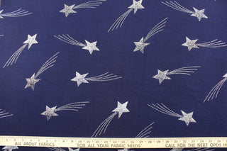  This Glittered Shooting Star in Navy adds a touch of sparkle and magic to any room. The glittered silver shooting stars against the deep navy blue background create a mesmerizing contrast that is sure to catch anyone's eye.  Enjoy ultimate comfort and flexibility with its 8 way stretch material.  Perfect for adding sparkle to special occasion apparel, dancewear, costumes, overlays, table tops, and decorations. 