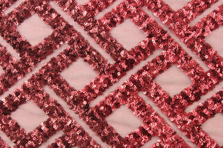 The Sequined Boxed in Burgundy features a rich burgundy color adorned with shimmery sequins.&nbsp; Crafted with a durable polyester tulle base, it is great for adding a touch of elegance to any event or occasion.&nbsp; Perfect for adding sparkle to special occasion apparel, dancewear, costumes, overlays, table tops, and decorations.&nbsp;