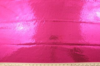 Achieve the perfect combination of comfort and style with our Sequined Shimmer in Hot Pink.  Made from a high-quality 8 way stretch polyester and lycra© base, this fabric provides flexibility and durability.  Perfect for adding sparkle to special occasion apparel, dancewear, costumes, overlays, table tops, and decorations. 