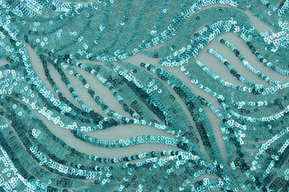 The Sequined Aqua Garden in Sky Blue is expertly crafted with a polyester tulle base and delicate sequins.  Its decorative design brings a touch of whimsy, while the sky blue color creates a calming atmosphere.  Perfect for adding sparkle to special occasion apparel, costumes, overlays, table tops, and decorations. 