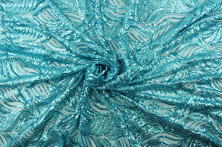 The Sequined Aqua Garden in Sky Blue is expertly crafted with a polyester tulle base and delicate sequins.  Its decorative design brings a touch of whimsy, while the sky blue color creates a calming atmosphere.  Perfect for adding sparkle to special occasion apparel, costumes, overlays, table tops, and decorations. 
