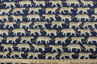  striking white and brown tiger design on a navy blue background, this fabric offers 51,000 double rubs and 500 UV hours, making it both strong and fade-resistant. Plus, its water repellent properties make it ideal for various weather conditions. Great for<span data-mce-fragment="1">&nbsp;cushions, tablecloths, upholstery projects, decorative pillows and craft projects.&nbsp; Recommended to store away when not in use.</span>