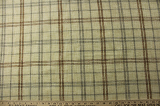 The P/Kaufmann© Macalister in Stone is a versatile and stylish addition to any room. This chenille fabric, features a classic tan, stone, and brown plaid design that adds a touch of sophistication to your décor. Great for upholstery projects including sofas, chairs, dining chairs, pillows, handbags and craft projects.&nbsp;&nbsp;