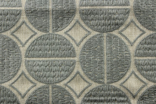 P/Kaufmann© Medallion in Pewter offers versatility with its multipurpose use. The embroidered geometric pewter medallions bring a touch of elegance to any project, while the natural background adds a touch of warmth. With a durability of 51,000 double rubs, this fabric is perfect for upholstery, bedding, and drapery, making it a must-have for any project.