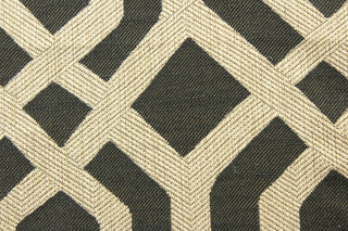 his multipurpose Batu in Ebony fabric boasts a striking geometric jacquard design with luxurious gold accents. Its versatility and elegant look make it the perfect addition to any project or space. This fabric would&nbsp;compliment&nbsp;any room whether you use it for&nbsp;drapery&nbsp;or throw pillows.&nbsp;It is also perfect for light upholstery, home décor,&nbsp;duvet&nbsp;covers and apparel.&nbsp;The possibilities are endless.