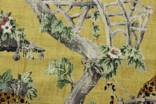 scenic jungle chinoiserie print with cheetahs, floral branches, and a variety of colors including green, gray, mauve, tan, black, and white, all set against a distressed gold background. This fabric has a soil and stain repellant finish, and a durability rating of 15,000 double rubs. Perfect for window accents (draperies, valances, curtains and swags) cornice boards, accent pillows, bedding, headboards, cushions, ottomans, slipcovers and upholstery. <span data-mce-fragment="1">&nbsp;</span>