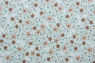 Cicely features an intricate floral pattern in shades of brown, tan, white, and black, set against a light green background.  The high-quality cotton material ensures lasting durability and softness.  It would be great for apparel, quilting, crafting and sewing projects.  