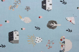 Happy Home is a whimsical house print featuring trees, flowers, rabbits, and hats in varying shades of pink, white, black, gray, and red against a soft blue background. Perfect for any living space, it is sure to bring a splash of joy to your home. The high-quality cotton material ensures lasting durability and softness. The versatile lightweight fabric is soft and easy to sew.  It would be great for apparel, quilting, crafting and sewing projects.  
