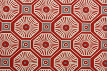 Load image into Gallery viewer,  This multi-use fabric features a fun geometrical print featuring persimmon, light beige, and gray tones, making it perfect for a range of home décor projects.  Treated with a soil and stain repellant finish, this fabric is durable with a 100,000 double rub rating.  It can be used for several different statement projects including window accents (drapery, curtains and swags), toss pillows, headboards, bed skirts, duvet covers, upholstery, and more.
