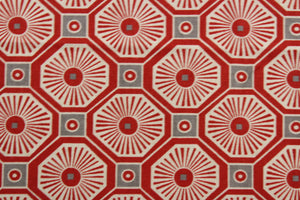  This multi-use fabric features a fun geometrical print featuring persimmon, light beige, and gray tones, making it perfect for a range of home décor projects.  Treated with a soil and stain repellant finish, this fabric is durable with a 100,000 double rub rating.  It can be used for several different statement projects including window accents (drapery, curtains and swags), toss pillows, headboards, bed skirts, duvet covers, upholstery, and more.
