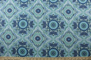  featuring a decorative medallion print in soothing shades of blue and green with a touch of crisp white.&nbsp;With 15,000 double rubs, this durable and stylish fabric is perfect for adding a touch of elegance to any space. Plus, with 500 UV hours and water and stain resistant properties, it's great for lounge cushions, pool furniture, tablecloths, decorative pillows and upholstery projects. <span data-mce-fragment="1">Recommended to store away when not in use.</span>