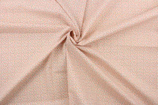   This fabric features a tiny floral design in orange and brown green set against a white background.
