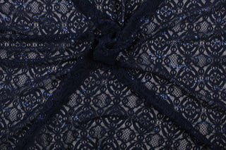 This stretch lace features a intricate medallion design in navy blue with shimmering sequins adding to its elegance.  It is sheer and breathable with a nice soft drape.  Uses include, apparel, dancewear, costumes, curtains and home decor.