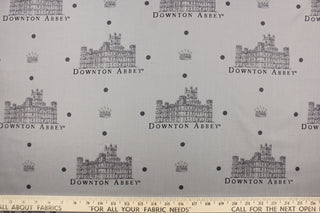  Featuring the Downton Abbey building and wording in gray and black with dark gray dots against a gray background. 