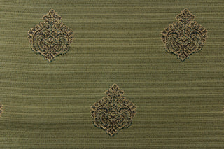 Ornamental damask medallion with hints of gold and dark green on a green background