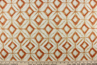 This fabric features a geometric design of diamonds in shades of orange with light khaki shading on a off white background. 