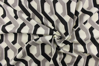This fabric features a link design in gray, black and white.