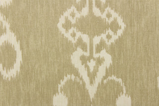  This fabric features an ikat design in a khaki and off white.