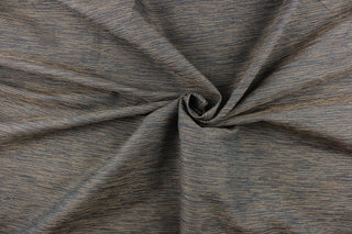 This mock linen features streaks of gold and brown tones against a dark navy blue. 