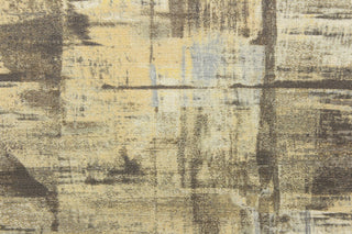 This fabric features an abstract design in shades of yellow and gray .