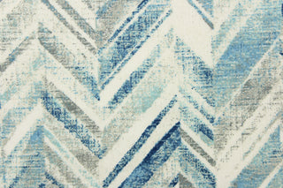 This fabric features a chevron design in shades of blue and gray and white. 
