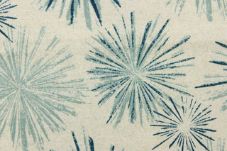 This fabric features a firework like design in teal blue tones and off white with hints of gray.