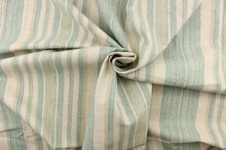 This cotton blend fabric features pale green and khaki stripes stripes set against a light beige background.  