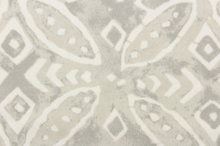 This outdoor fabric features a medallion design in white against a pale gray .