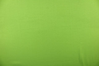 Poplin fabric in a solid lime green. 
