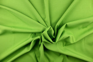 Poplin fabric in a solid lime green. 