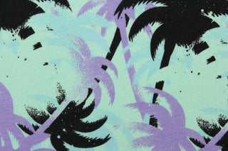 This jersey fabric features a palm tree design in black, purple, pale blue and seafoam green.