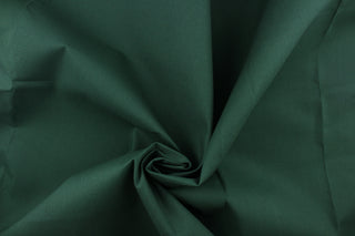  Twill fabric in solid dark green .