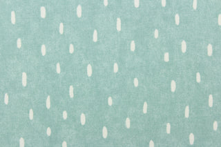 This calming fabric features cream colored raindrops on a seafoam background. 