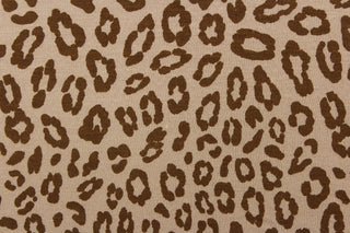 This jersey fabric features a leopard design in brown against a taupe. This is a interlock knit acetate jersey.