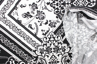 This fabric features a bandana design in black and white. Use this for apparel, etc. This fabric is fleece lined.