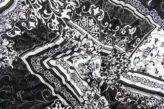 This fabric features a bandana design in black and white. Use this for apparel, etc. This fabric is fleece lined.