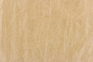 This taffeta fabric features a crinkle in iridescent light gold.
