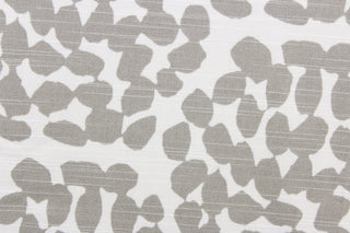 This fabric features a dot design in gray against white.