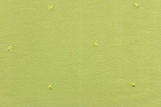 This beautiful jacquard fabric features an embroider nail head design in a rich lime green color.