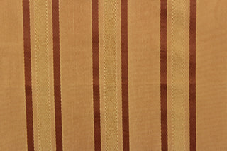 This stunning yarn dyed fabric features a striped pattern in copper tones and gold.